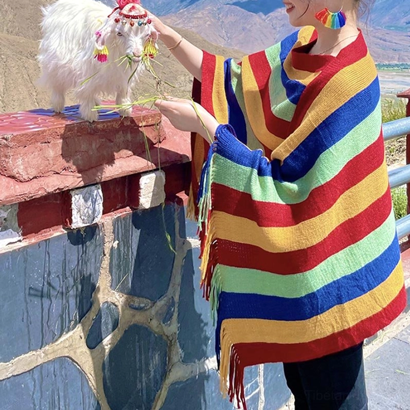 Tibetan striped poncho shawl full-body front view with uniform stripe colors worn outdoors near stone railings