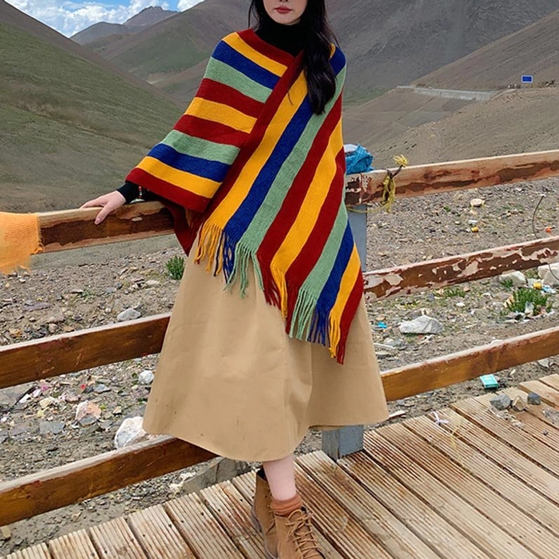 Tibetan striped shawl worn indoors showing layering versatility with casual outfit styling