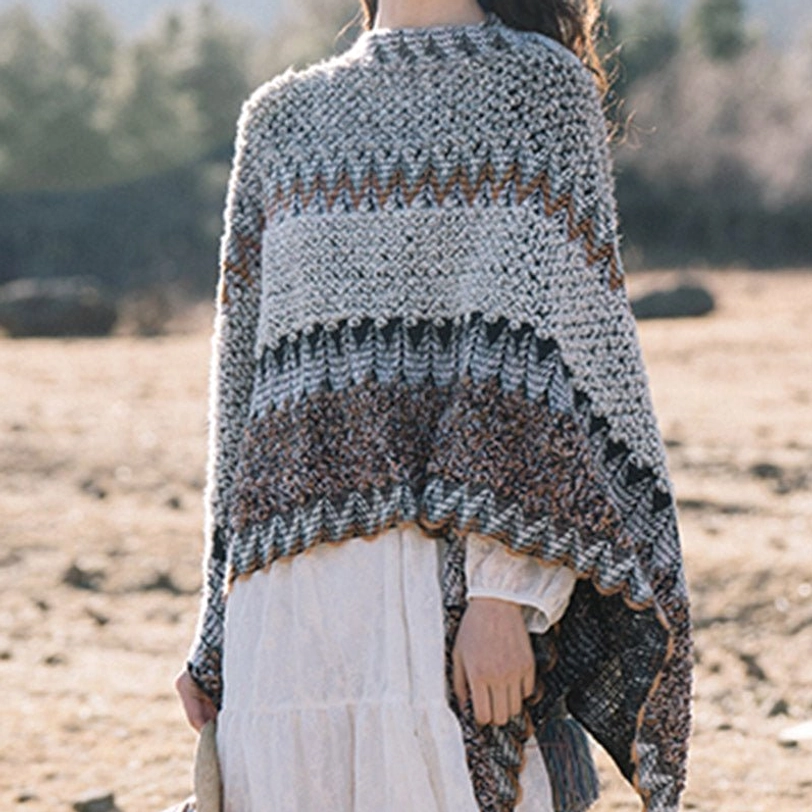 Tibetan striped shawl used as travel blanket on airplane or outdoor adventure showing portability and warmth