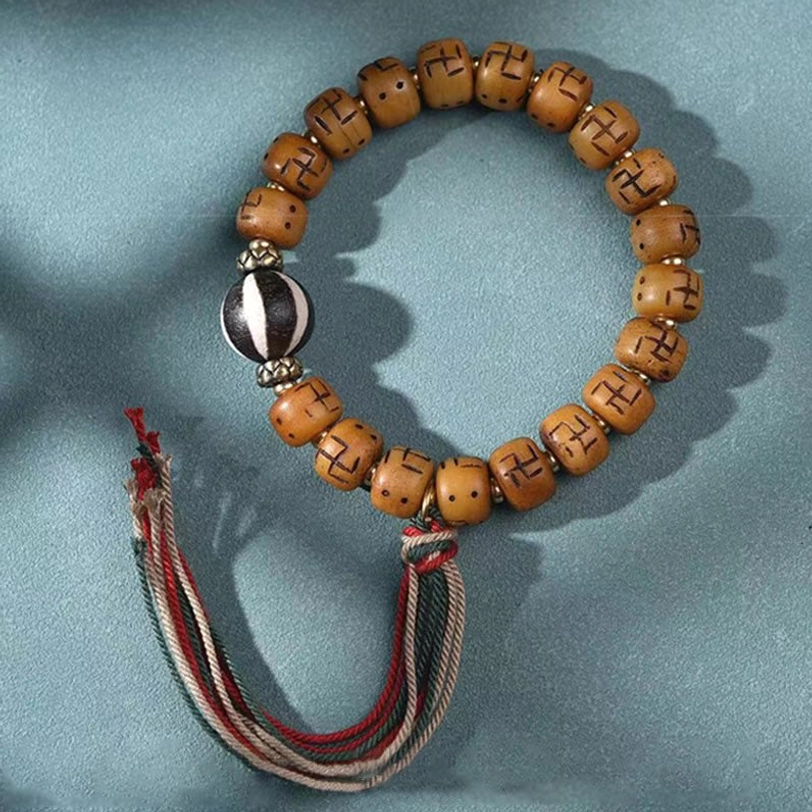 Authentic handcrafted Tibetan swastika bone bracelet - spiritual symbol of auspiciousness and well-being in Buddhist tradition