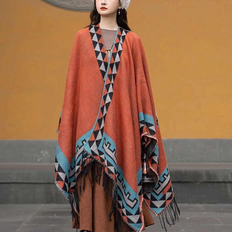 Side angle view of geometric tassel shawl poncho displaying complete pattern layout and authentic tribal craftsmanship
