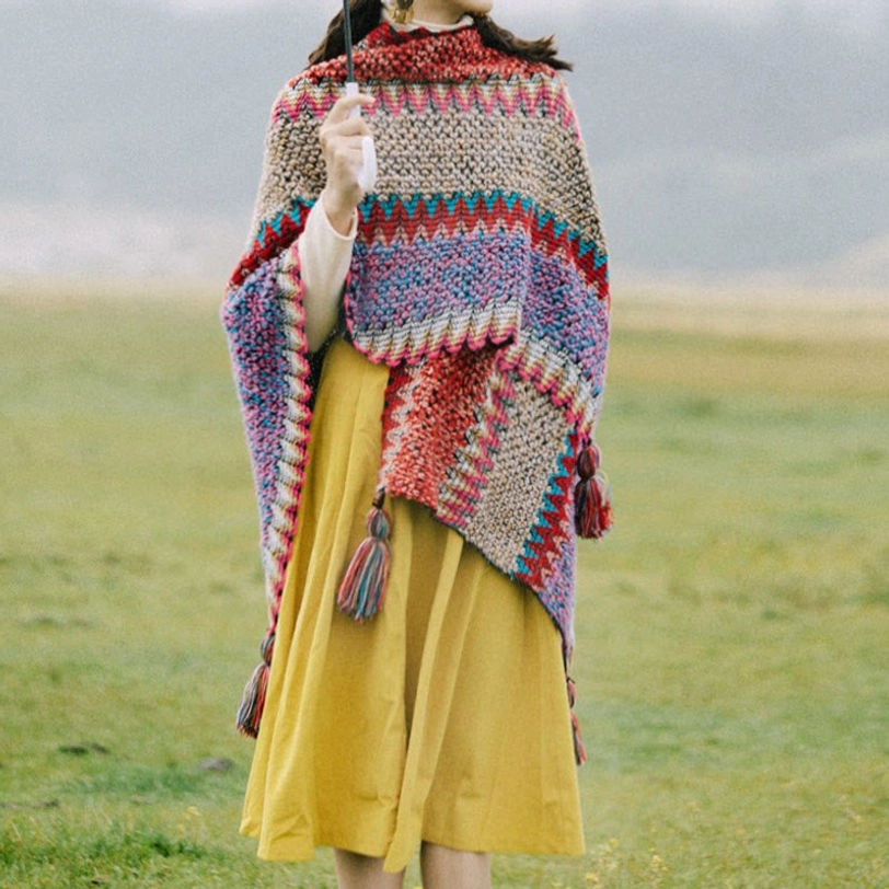 Multi-color ethnic Tibetan tassel shawl with woven pattern and thick knitted texture, front half-side view