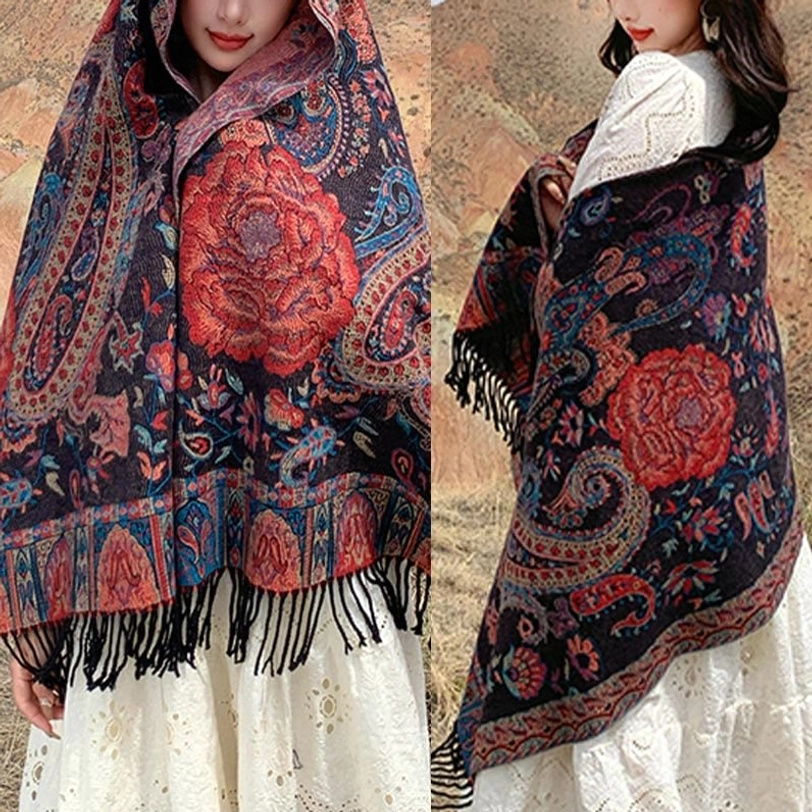 Tibetan tassel shawl draped elegantly for evening wear, highlighting soft fabric flow and sophisticated silhouette