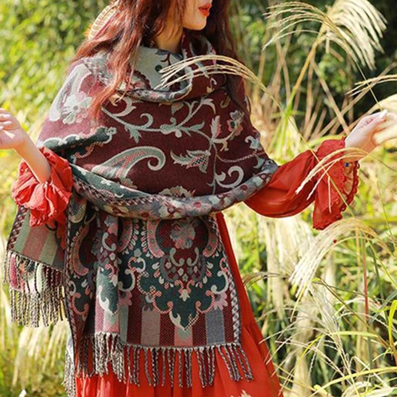 Tibetan botanical tassel shawl neatly wrapped showing tassel hem detail and coordinated paisley stripe design
