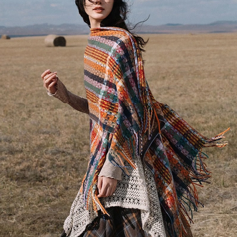 Bohemian Tibetan tassel shawl with flowing fringed hem and mixed stripe patterns, side profile displaying loose elegant drape