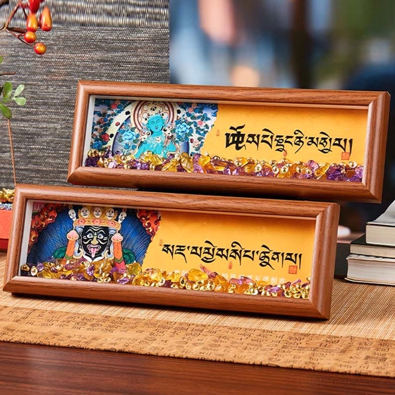 Thangka frame product lifestyle shot showing spiritual home décor arrangement with Buddhist art and healing crystals
