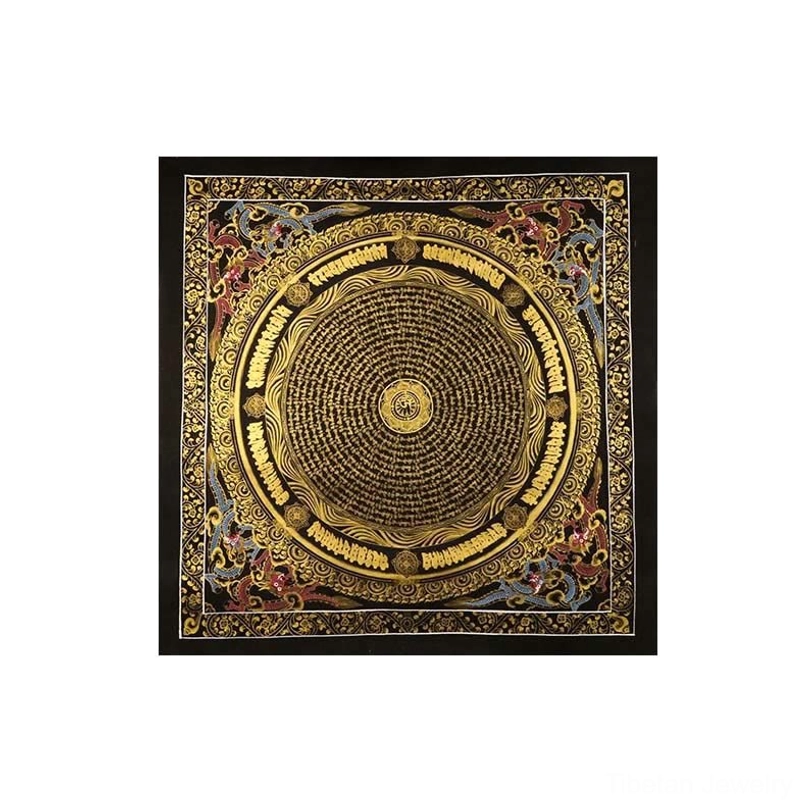 Framed Tibetan mandala thangka with black frame, dense gold scripture design, and colorful border accents