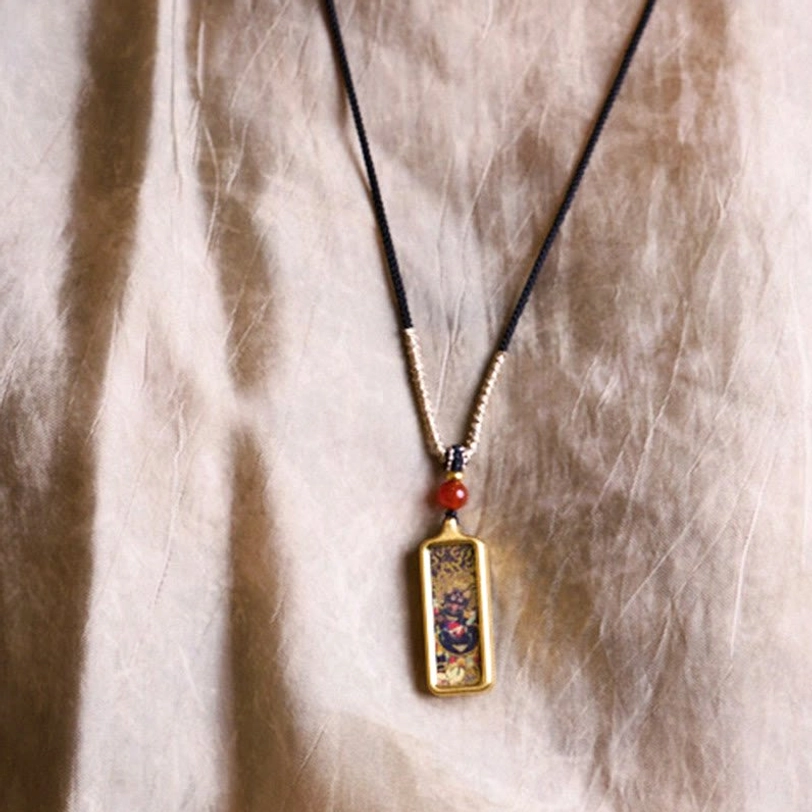 Complete Tibetan thangka hand-painted necklace set with mixed black and braided cord, small decorative deity pendant, and red accent bead