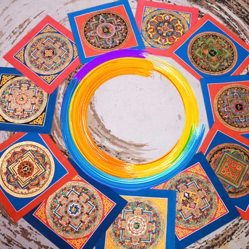 Tibetan thangka with traditional silk border and handpainted religious symbols representing Buddhist philosophy