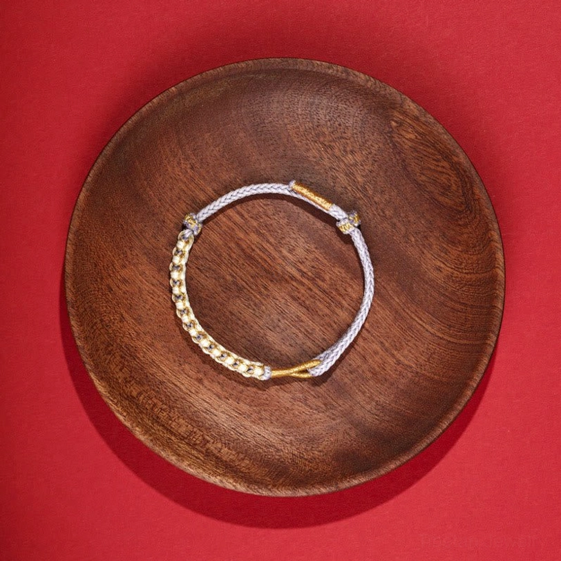 Delicate thin Tibetan braided bracelet with mixed colors and gold metal accents