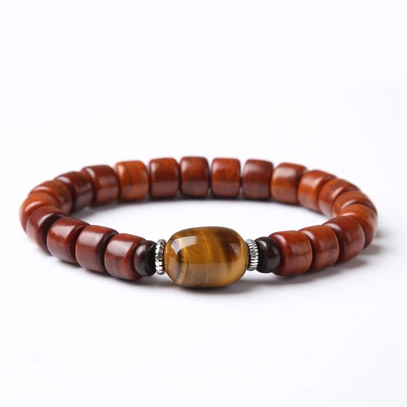 Tibetan bone bead bracelet with three-eyed dzi bead protective symbol worn