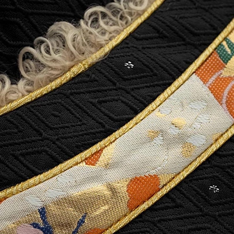 Tibetan ethnic winter top material composition showing premium blended fabric with fleece lining texture