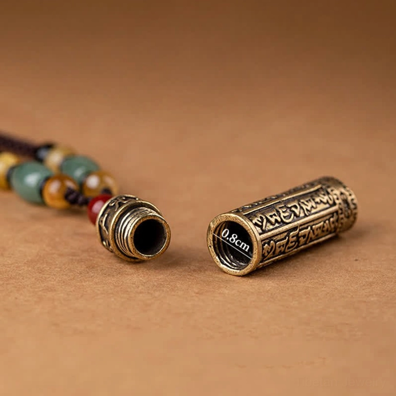 Traditional Tibetan Om Mani Padme Hum necklace with adjustable braided cord and bodhi seed charm details