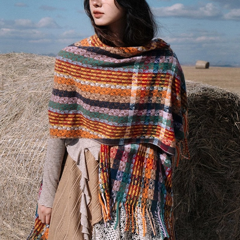 Tibetan striped tassel wrap styled as travel blanket showing versatile use and soft portable design