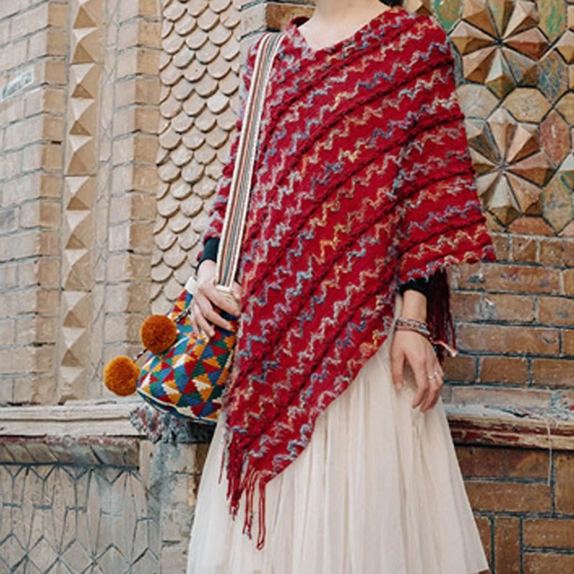 Tibetan travel shawl poncho with traditional striped pattern and versatile styling options
