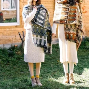 Two Tibetan ethnic tribal scarves with distinct geometric patterns and soft woven fabric, full body styling on cottage yard
