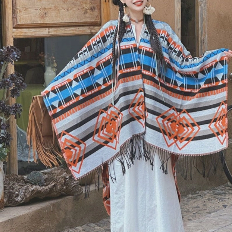 Front full-body view of ethnic geometric tassel poncho with rhombus tribal prints and loose bohemian fit