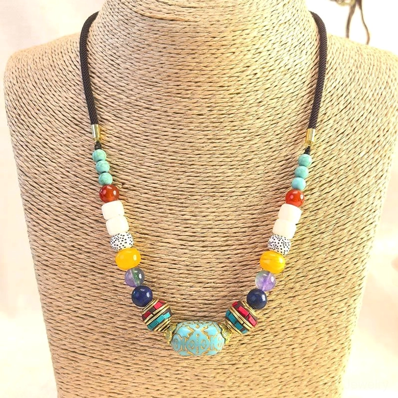 Tibetan turquoise beaded necklace worn on mannequin showing balanced bead arrangement and wearable design