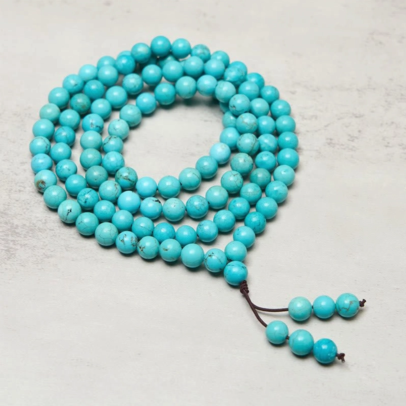 108 bead turquoise mala with darker matrix stones and traditional brown tassel - Tibetan prayer necklace detail view