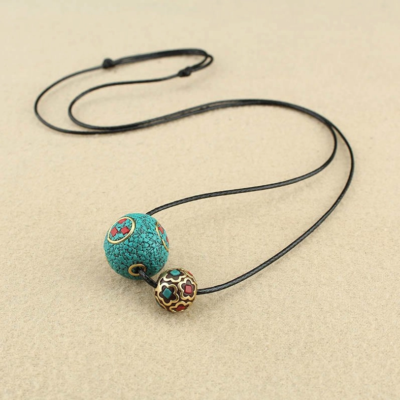 Full length adjustable Tibetan turquoise necklace laid flat on light surface, showing complete 40-75cm adjustable range