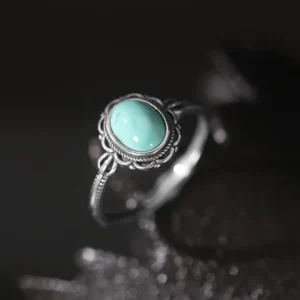 925 sterling silver tibetan protection ring with turquoise stone set in ornate filigree bezel, overhead view