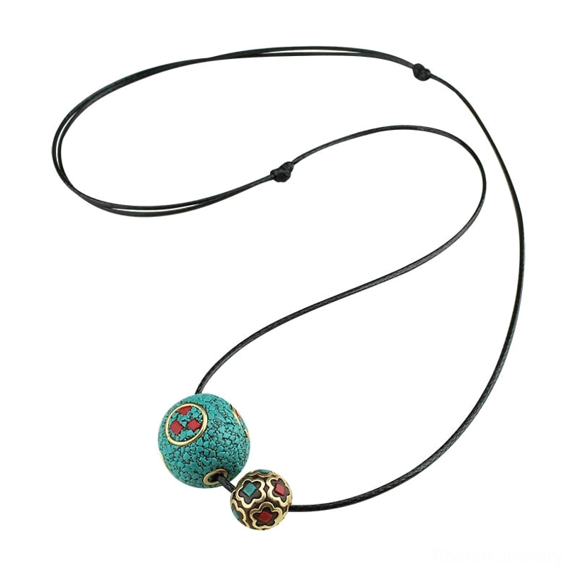 Tibetan throat chakra protection necklace with turquoise beads and decorative enamel elements for spiritual wellness
