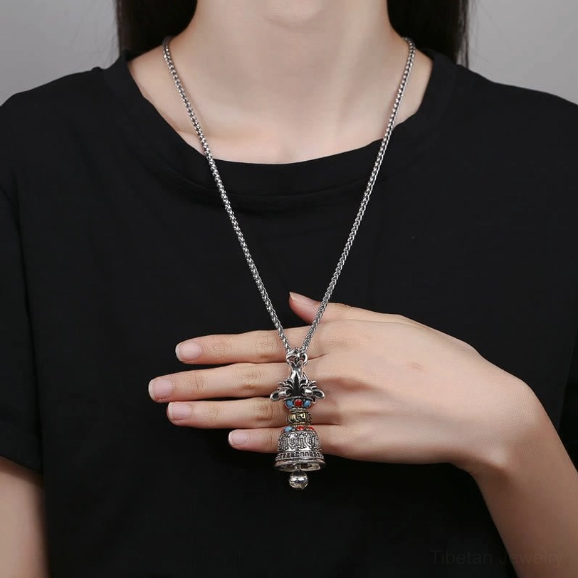 Tibetan Vajra Bell pendant necklace worn on black casual top showing 60cm necklace length, demonstrating how long sweater length pendant style looks when worn