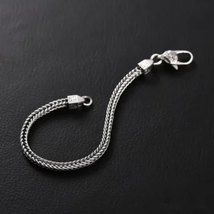 Tibetan Vajra Swastika Bracelet - Side view showing twisted texture chain with decorative clasp bead