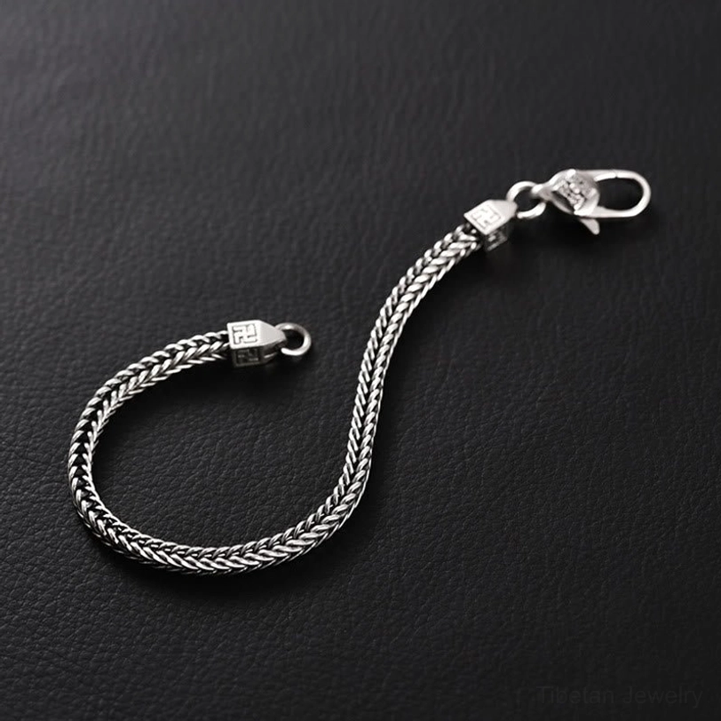 Tibetan Vajra Swastika Bracelet - Side view showing twisted texture chain with decorative clasp bead