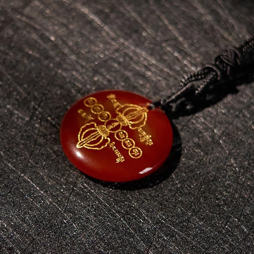 Tibetan Vajra Dorje necklace pendant with golden Dorje and Sanskrit symbol carvings on natural stone