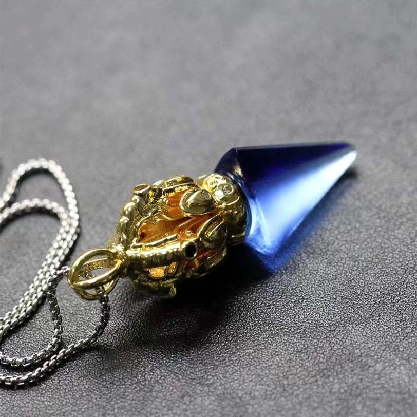 Reverse view of blue Tibetan Vajra Liuli crystal pendant necklace with decorative metal fitting