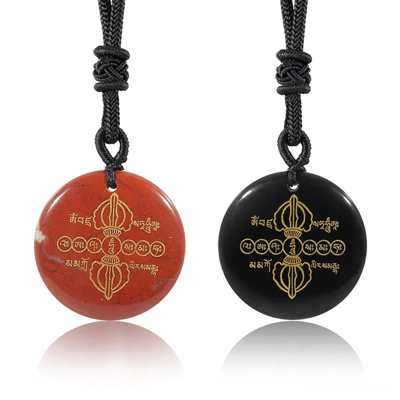 Comparison of two Vajra Dorje Tibetan necklaces - red stone and black obsidian variants with golden engravings on white background