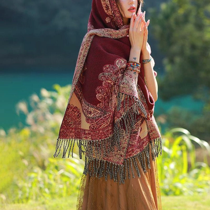 Tibetan paisley shawl worn as evening wrap over formal attire