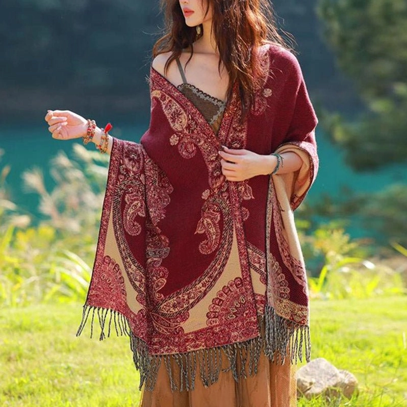Tibetan paisley shawl draped as blanket throw on sofa