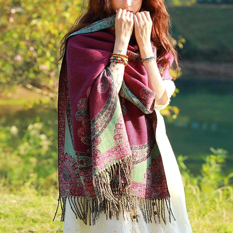 Tibetan paisley shawl worn as travel accessory on journey