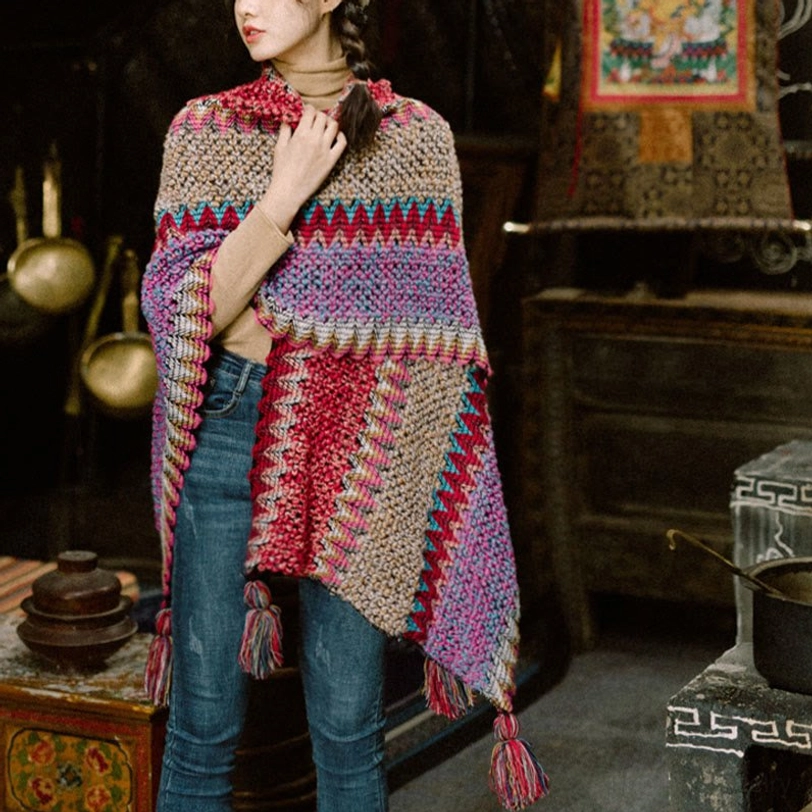 Warm Tibetan shawl poncho with multi-color stripe design and tassel decorations, indoor Tibetan-style room setting