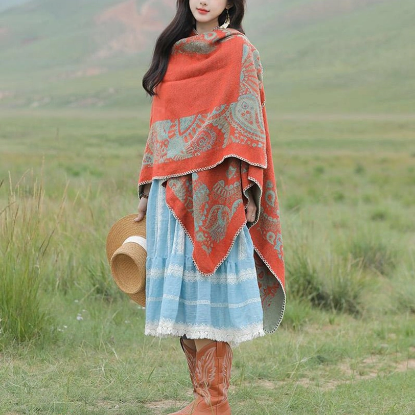 Tibetan warm wrap worn as layering piece over sweater and coat in outdoor setting