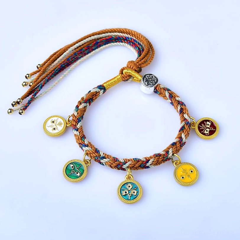 Colorful Tibetan five gods of wealth braided bracelet front view with five enamel metal pendants on light background