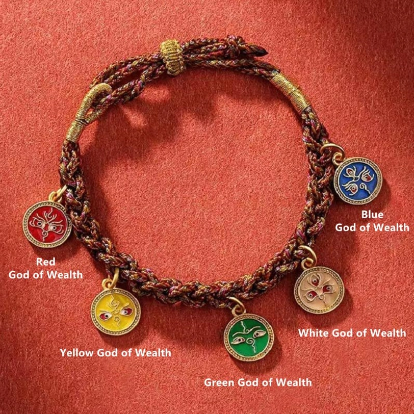 Tibetan Five God of Wealth bracelet flat lay with labeled four wealth deity pendants