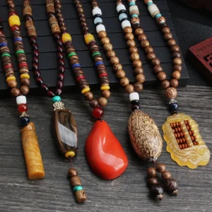 Collection of handmade Tibetan wenge wood bodhi seed necklaces with mixed agate and resin pendants in various styles