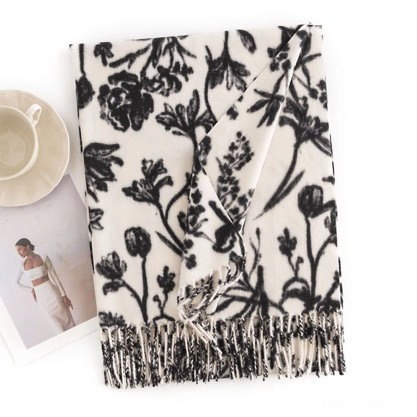 White Tibetan shawl with vintage floral prints, flat lay showing premium soft fabric and tassel details