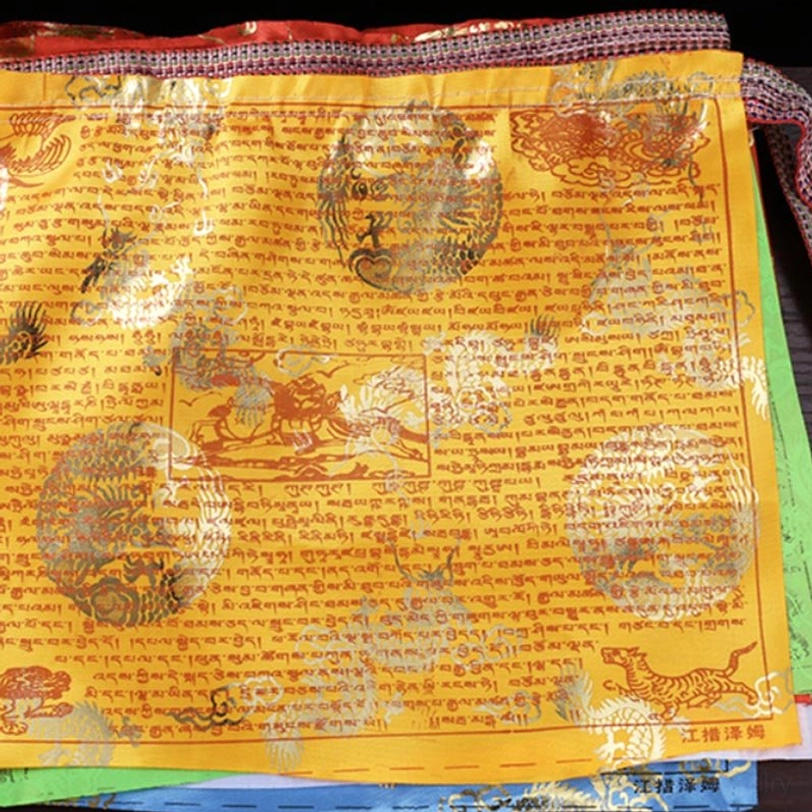 White and pink Tibetan prayer flag - gold foil dragon and mythical animal motifs with Tibetan blessings