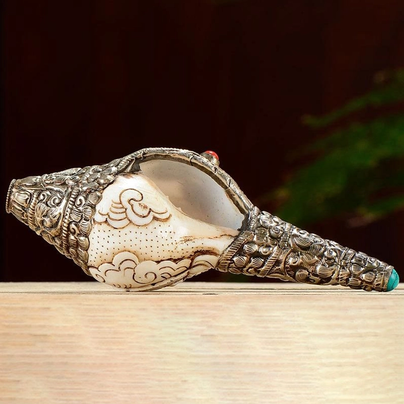 Tibetan White Tara hand-engraved conch shell with compassionate deity carving and silver decorative metalwork