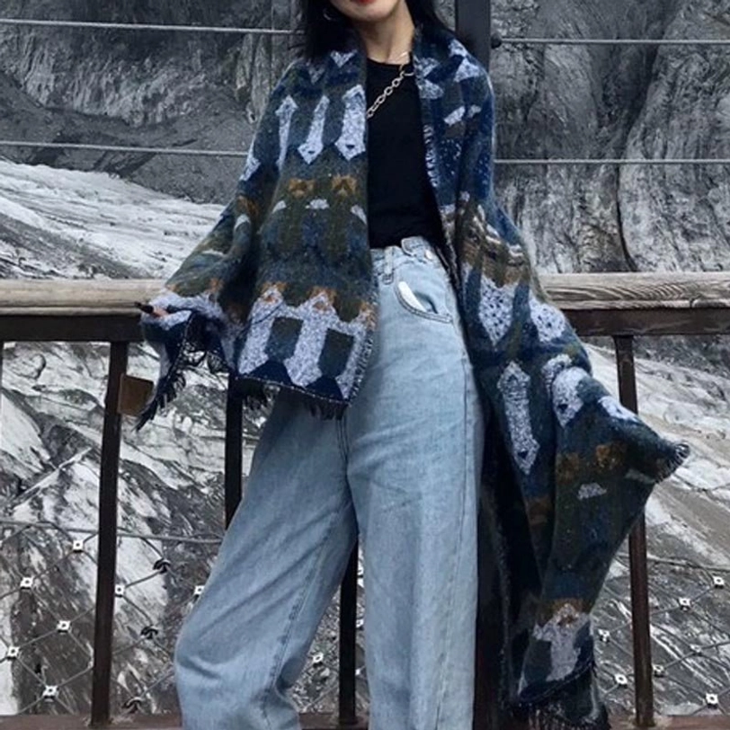 Tibetan wool scarf wrap with layered geometric prints, cozy warm fabric and traditional Himalayan craftsmanship details