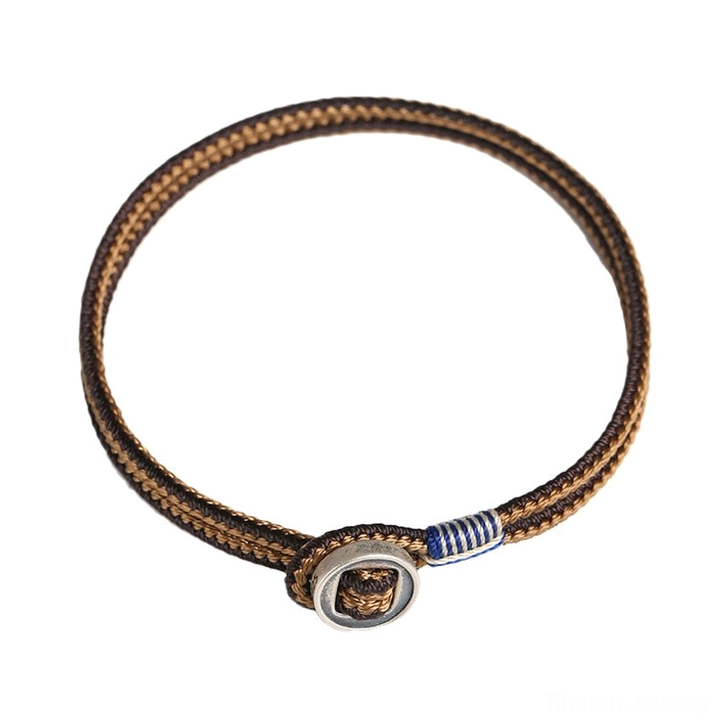 Tibetan woven string bracelet with silver button clasp, traditional buddhist protection symbol
