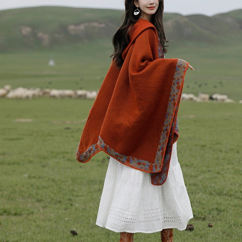 Oversized Tibetan wrap cloak back right side view paired with white lace midi dress and long hair