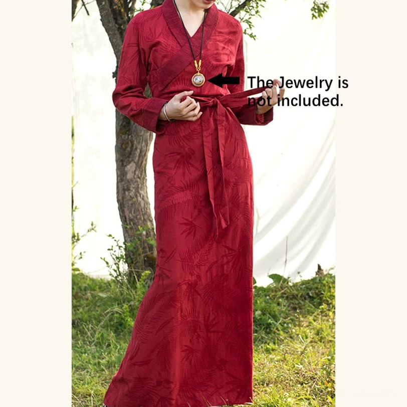 Flat lay product photography of Tibetan chuba maxi dress showing overall silhouette, color, and handwoven pattern design