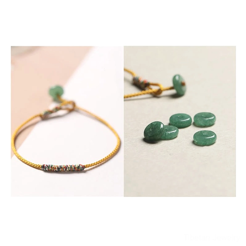 Yellow Tibetan braided bracelet with loose green aventurine donut-shaped beads showing material quality