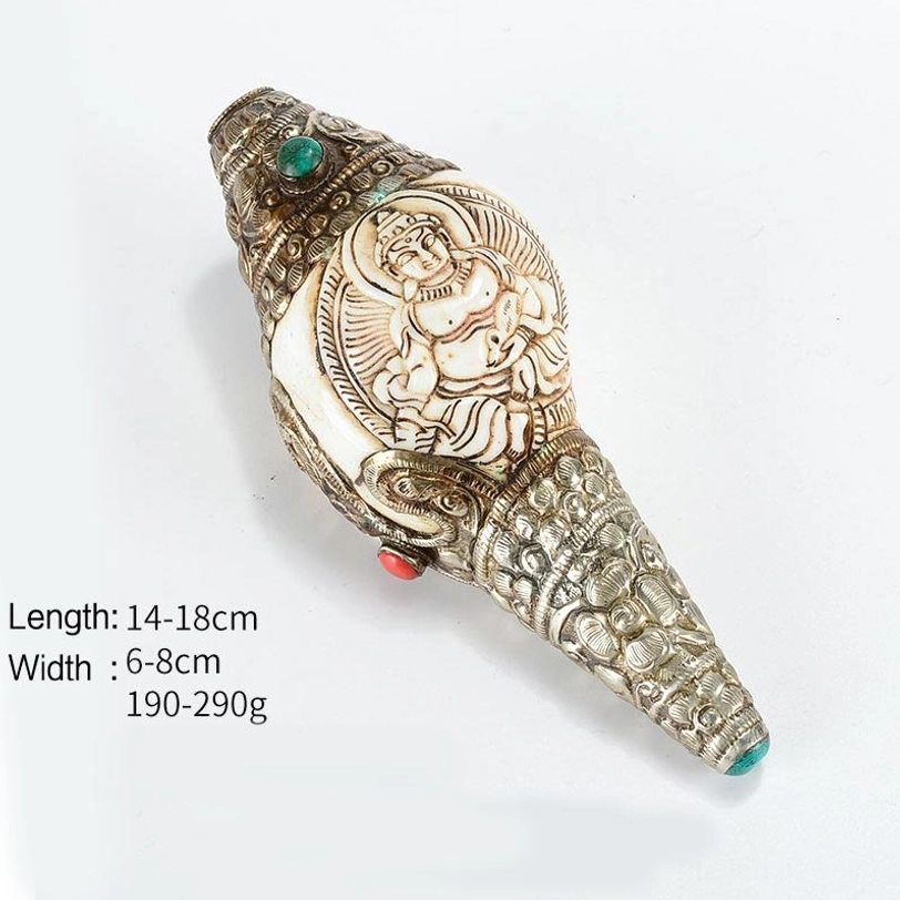 Tibetan Yellow God of Wealth hand-carved conch shell with intricate silver filigree and precious stone inlays