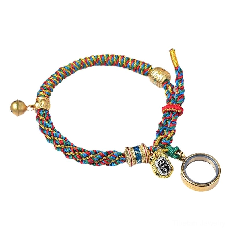 Front view of Tibetan multicolored braided amulet bracelet with gold bell, Om Mani Padme Hum scripture charm, and adjustable loop on white background